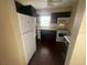 Modern kitchen with dark cabinets and tile floor at 431 N Boston Ave # B, Deland, FL 32724