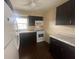 Modern kitchen with dark cabinets and tile floor at 431 N Boston Ave # B, Deland, FL 32724