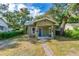 House exterior with a green stucco facade and a brick walkway at 112 S Chandler Ave, Deland, FL 32724