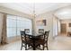 Dining area with glass-top table and four chairs, near a window at 227 Fort Florida Rd, Debary, FL 32713