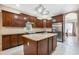 Island kitchen with stainless steel appliances and wood cabinets at 227 Fort Florida Rd, Debary, FL 32713