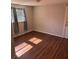 Well-lit bedroom with hardwood floors at 612 E Plymouth Ave, Deland, FL 32724