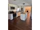 Updated kitchen with stainless steel appliances and island at 612 E Plymouth Ave, Deland, FL 32724