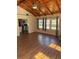 Spacious living area with wood ceilings and fireplace at 612 E Plymouth Ave, Deland, FL 32724