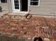 Brick patio with steps leading to back door entrance at 612 E Plymouth Ave, Deland, FL 32724