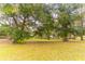 Large backyard with mature trees providing shade at 3347 Quail Roost Dr, Deland, FL 32720