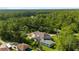 Aerial view of a residence with a sprawling yard in a peaceful wooded neighborhood at 3428 Longleaf Rd, Ormond Beach, FL 32174