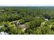 Aerial view of a single Gathering home surrounded by beautiful landscaping and lush, mature trees at 3428 Longleaf Rd, Ormond Beach, FL 32174