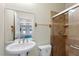 Bathroom featuring a walk-in shower and view to the indoor pool at 3428 Longleaf Rd, Ormond Beach, FL 32174