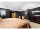 Bedroom featuring a wet bar, dark walls and carpet flooring at 3428 Longleaf Rd, Ormond Beach, FL 32174