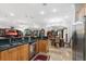 Open concept kitchen showcasing a stainless steel refrigerator and seamless transition into dining and living spaces at 3428 Longleaf Rd, Ormond Beach, FL 32174