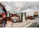 Bright living room featuring large windows, tile flooring, and comfortable seating arrangement at 3428 Longleaf Rd, Ormond Beach, FL 32174