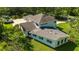 A lovely home exterior featuring well-manicured grass, lush trees, and an inviting atmosphere at 3428 Longleaf Rd, Ormond Beach, FL 32174