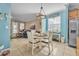 Casual breakfast nook with a round table and chairs, adjacent to the kitchen at 450 W Delaware Ave, Lake Helen, FL 32744