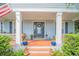 Welcoming front porch featuring a large door, wreath, and ample space at 450 W Delaware Ave, Lake Helen, FL 32744