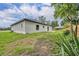 Spacious backyard with a newly-installed fence, offering plenty of room for outdoor activities and relaxation at 210 E Baxter St, De Leon Springs, FL 32130