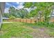 Large backyard with a new wooden fence at 210 E Baxter St, De Leon Springs, FL 32130