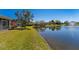 Scenic view of pond with fountain, complemented by lush greenery and a well-maintained lawn at 309 Chesham St, Ormond Beach, FL 32174