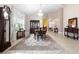 Elegant dining room with a chandelier, and an antique hutch at 309 Chesham St, Ormond Beach, FL 32174