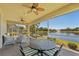 Enjoy an outdoor dining area on a screened lanai with views of the lake with a water feature at 309 Chesham St, Ormond Beach, FL 32174