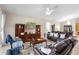 Relaxing living room featuring plush leather seating, entertainment center, and natural light at 309 Chesham St, Ormond Beach, FL 32174