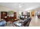 Spacious living room with plush leather seating, large windows, and entertainment center at 309 Chesham St, Ormond Beach, FL 32174