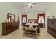 An ample main bedroom features a vaulted ceiling and abundant drawer space at 309 Chesham St, Ormond Beach, FL 32174