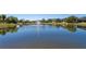 Scenic view of a pond with a fountain, enhancing the neighborhood's tranquility and charm at 309 Chesham St, Ormond Beach, FL 32174