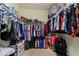 This expansive walk-in closet has ample space for hanging and storing clothes and other personal items at 309 Chesham St, Ormond Beach, FL 32174