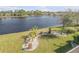 Landscaped backyard with lake view at 341 Perfect Dr, Daytona Beach, FL 32124