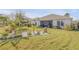 Landscaped backyard with tropical plants at 341 Perfect Dr, Daytona Beach, FL 32124