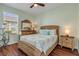 Guest bedroom with wood-framed bed and light-colored decor at 341 Perfect Dr, Daytona Beach, FL 32124