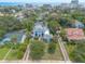 Expansive aerial shot showcasing a lovely neighborhood with an ocean view in the distance at 724 N Oleander Ave, Daytona Beach, FL 32118