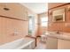 Bathroom with bathtub, tile floor and walls, and vanity at 724 N Oleander Ave, Daytona Beach, FL 32118