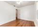 Bedroom features hardwood floors, a ceiling fan, and a window at 724 N Oleander Ave, Daytona Beach, FL 32118