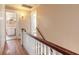 Hallway with hardwood floors and access to rooms, including bathroom at 724 N Oleander Ave, Daytona Beach, FL 32118