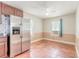 Kitchen featuring stainless steel refrigerator, and terra cotta tile floors at 724 N Oleander Ave, Daytona Beach, FL 32118