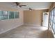 Living room with tile floors, ample windows, and a door at 724 N Oleander Ave, Daytona Beach, FL 32118