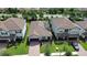 Aerial view of houses with brown roofs and solar panels at 257 Ancona Ave, Debary, FL 32713