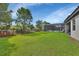 Large backyard with fenced-in pool and lush grass at 257 Ancona Ave, Debary, FL 32713