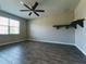 Large bedroom with wood-look floors and ceiling fan at 257 Ancona Ave, Debary, FL 32713