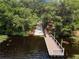 Community dock providing lake access with a wooden deck at 257 Ancona Ave, Debary, FL 32713