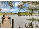 Serene waterfront view with a wooden dock at 257 Ancona Ave, Debary, FL 32713