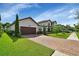 Attractive home exterior with a brick driveway and well-manicured lawn at 257 Ancona Ave, Debary, FL 32713
