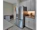 Stainless steel refrigerator in a kitchen with gray counters at 257 Ancona Ave, Debary, FL 32713