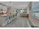 Open concept kitchen with island and view of dining area at 257 Ancona Ave, Debary, FL 32713