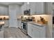Kitchen features stainless steel appliances and light cabinets at 257 Ancona Ave, Debary, FL 32713