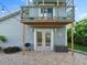 Back exterior with patio, balcony and outdoor grill, great for summer entertaining and relaxing at 4011 S Peninsula Dr, Port Orange, FL 32127