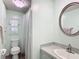 Stylish bathroom features a shower, toilet, and sink with modern fixtures, providing a comfortable and functional space at 824 Silver Oak Ave, The Villages, FL 32159