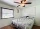 Bright bedroom featuring a comfortable bed, ceiling fan, and natural light, offering a serene and inviting space at 824 Silver Oak Ave, The Villages, FL 32159